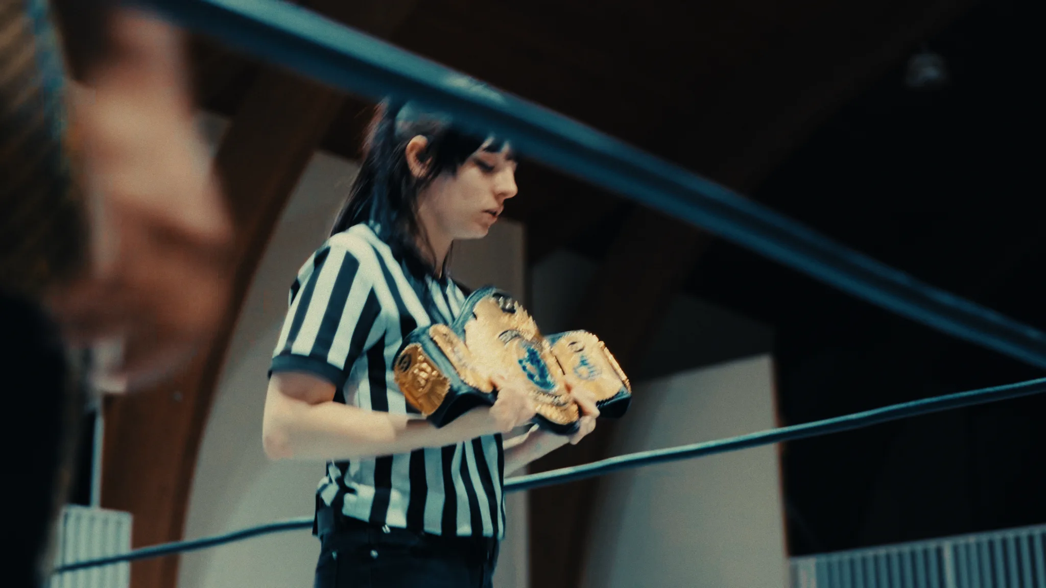 Championship belts held by a referee