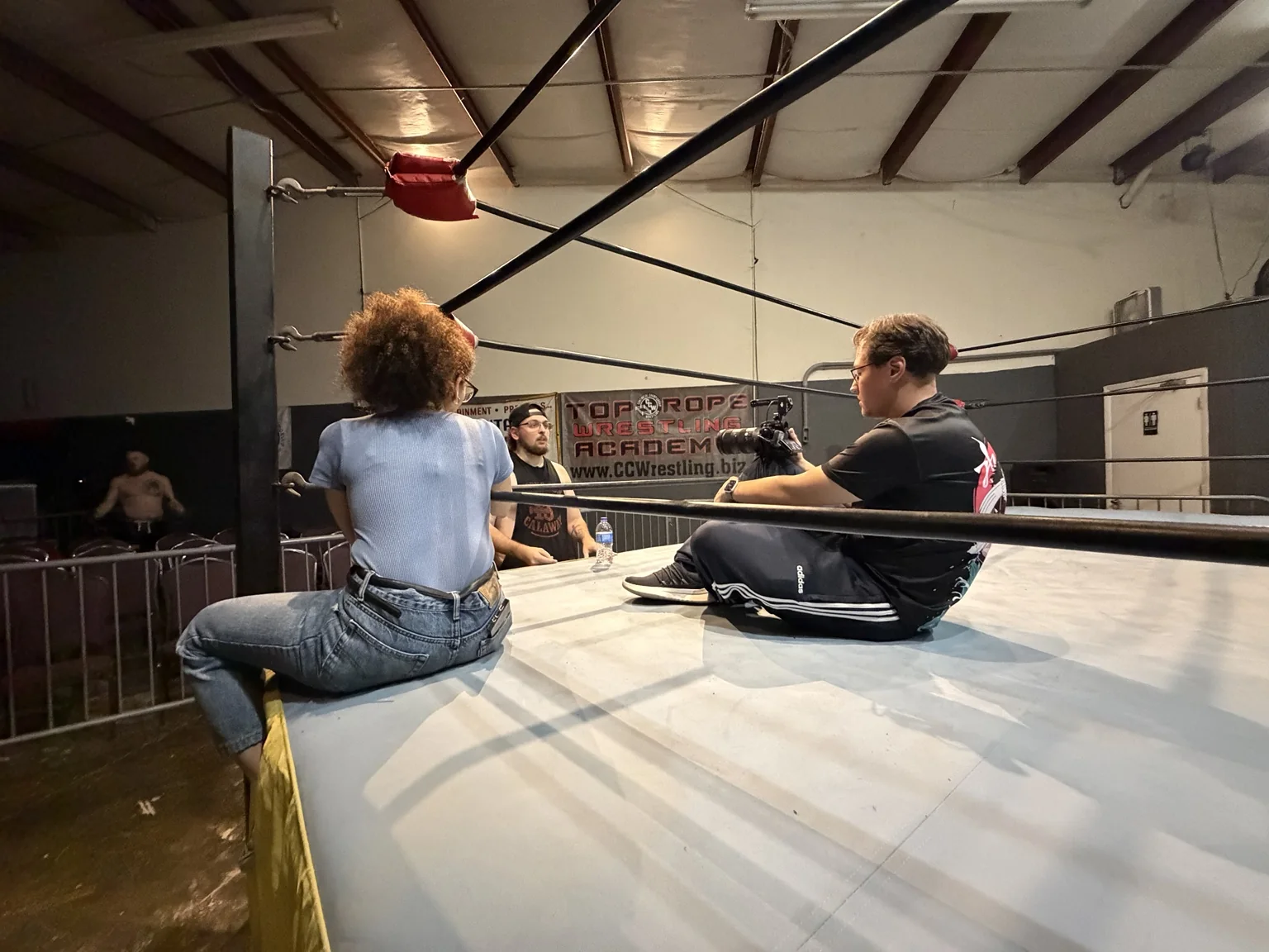 Crew working inside a wrestling ring