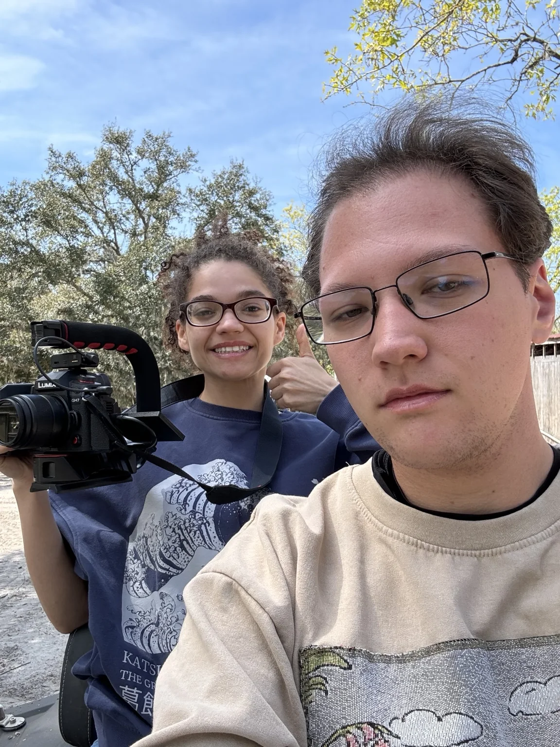 Two-person documentary crew outdoors